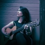 Woman playing guitar